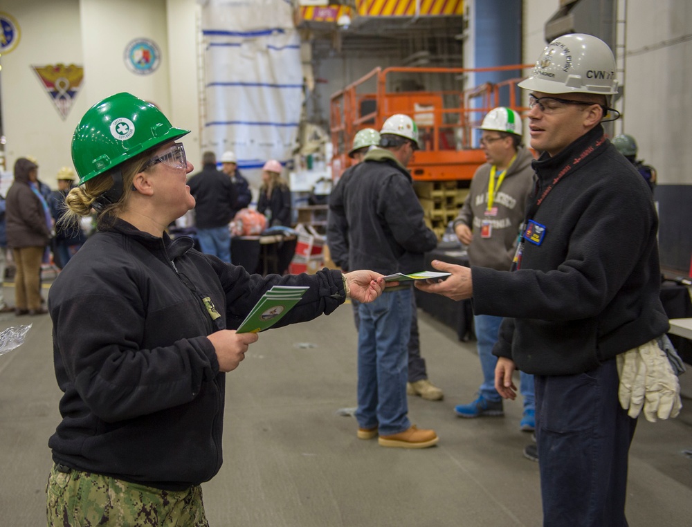 GHWB Sailor Hands Out Safety Flyers