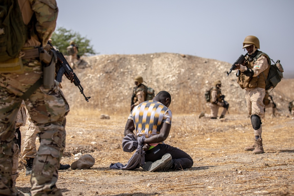 Burkinabe soldiers conduct presence patrols during Flintlock 20