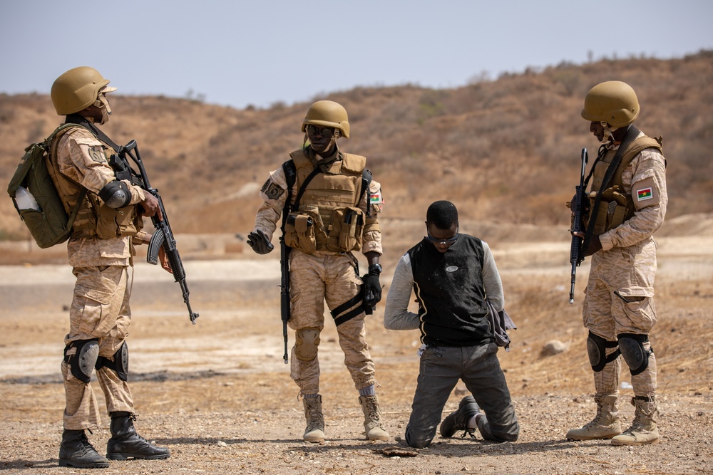 Burkinabe soldiers conduct presence patrols during Flintlock 20