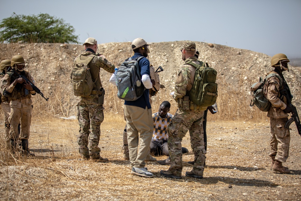 Burkinabe soldiers conduct presence patrols during Flintlock 20