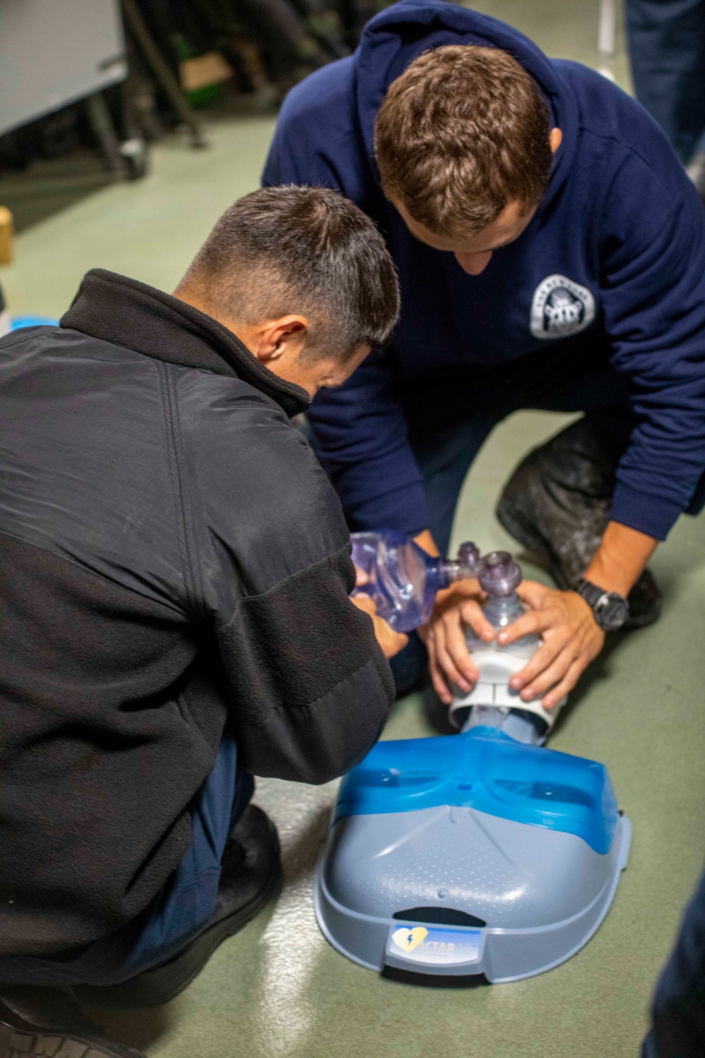 Sailors take part in a CPR class