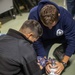 Sailors take part in a CPR class