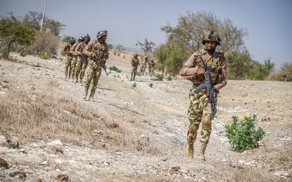 Soldiers in the Nigerian Army simulate conducting a patrol during a drill as part of FLINTLOCK 20