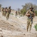 Soldiers in the Nigerian Army simulate conducting a patrol during a drill as part of FLINTLOCK 20