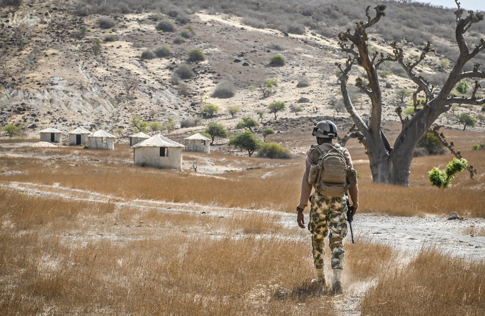 Soldier in the Nigerian Army posts as a lookout during a drill as part of FLINTLOCK 20