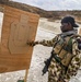 A Nigerian Navy Sailor checks his grouping during a live-fire exercise as part of FLINTLOCK 20