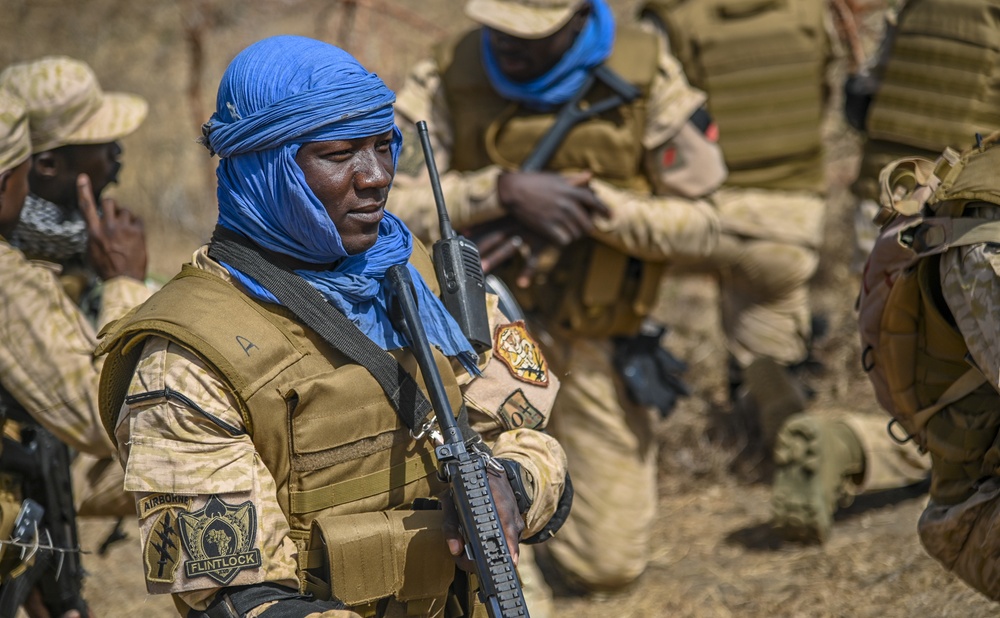 A Burkina Faso Soldier simulates conducting a patrol during FLINTLOCK 20