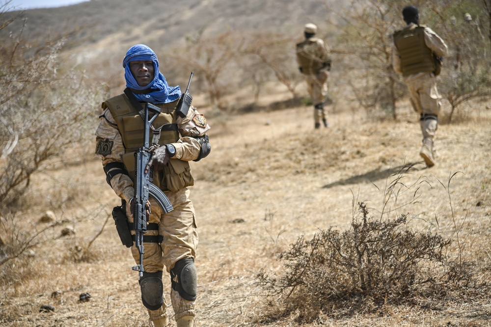 A Burkina Faso Soldier simulates conducting a patrol during FLINTLOCK 20