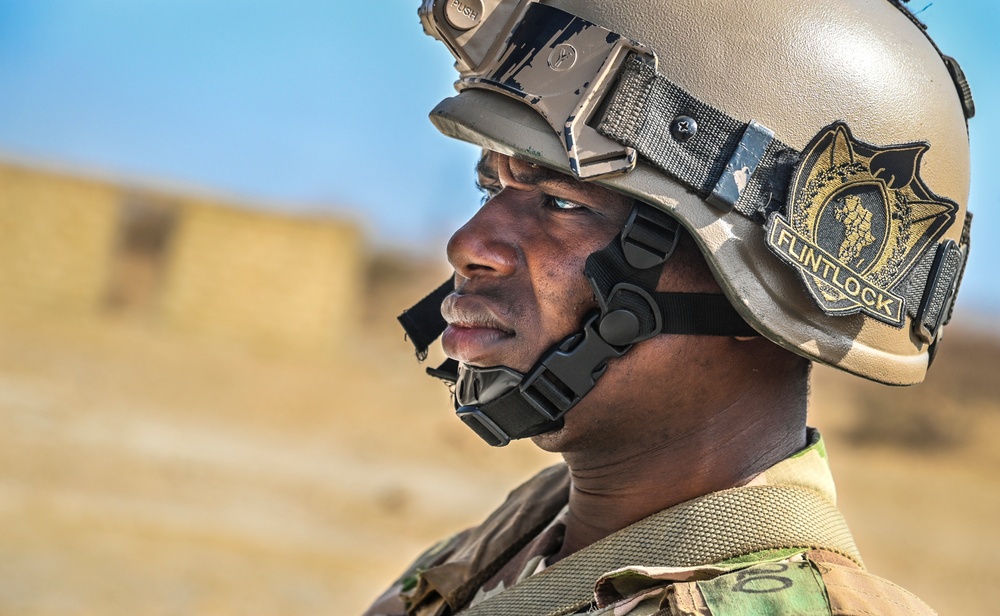 A Nigerian Soldier simulates conducting a patrol during FLINTLOCK 20