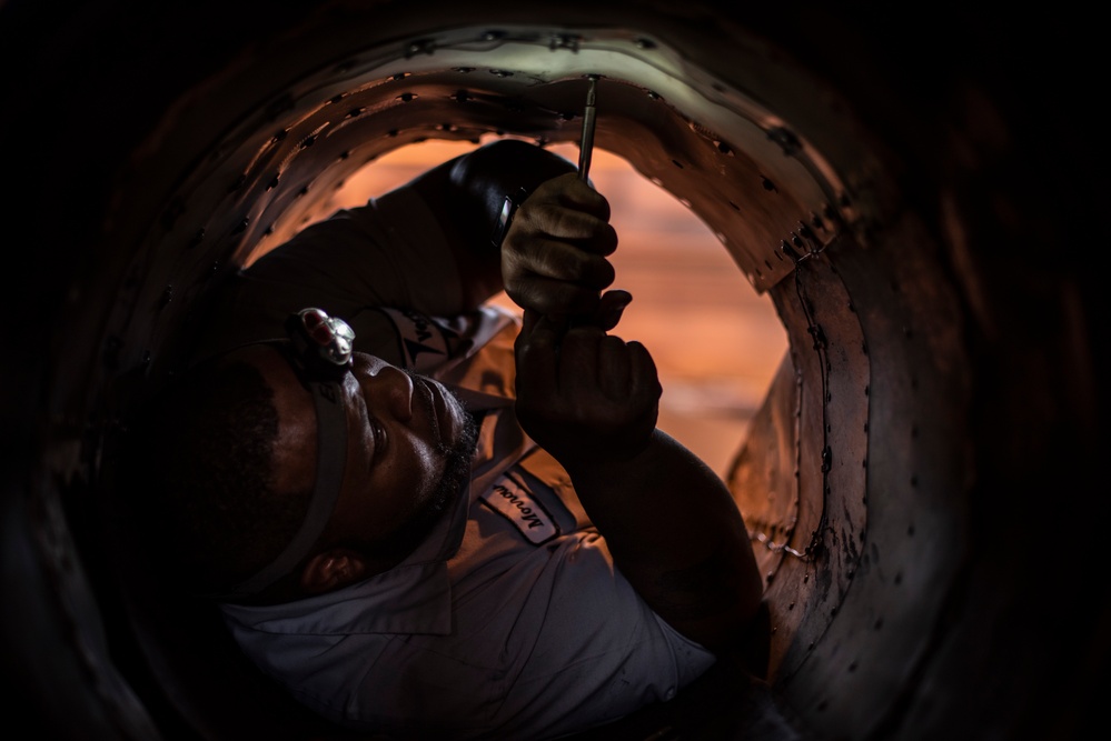 Civilian Contractor repairs a T-38 Talon