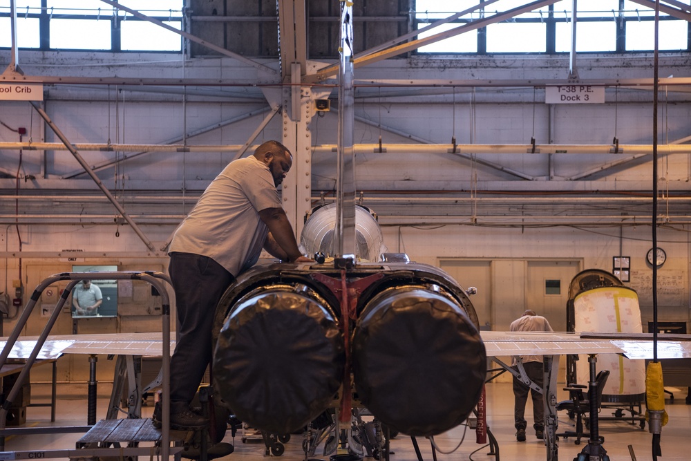 Civilian Contractor repairs a T-38 Talon