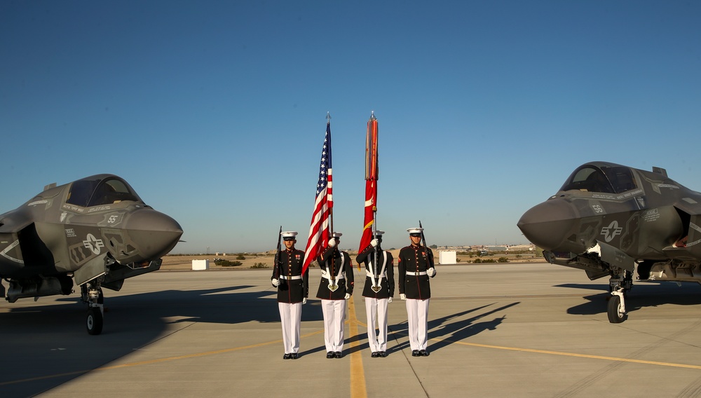 Marines with the Battle Color Detachment pose for photos on the flight line
