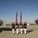Marines with the Battle Color Detachment pose for photos on the flight line