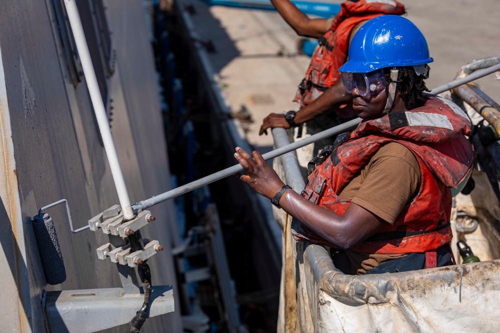 Sailors paint the side