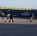 Sailors and Marines take part in a cook out on the pier