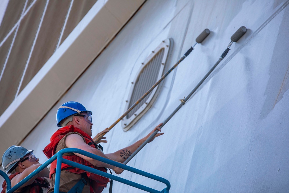 Sailors paint the side