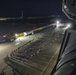 Sailors and Marines take part in a cook out on the pier