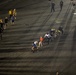 Sailors adn Marines take part in a cook out on the pier