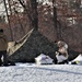 Cold-Weather Operations Course Class 20-03 students build Arctic tents during training at Fort McCoy