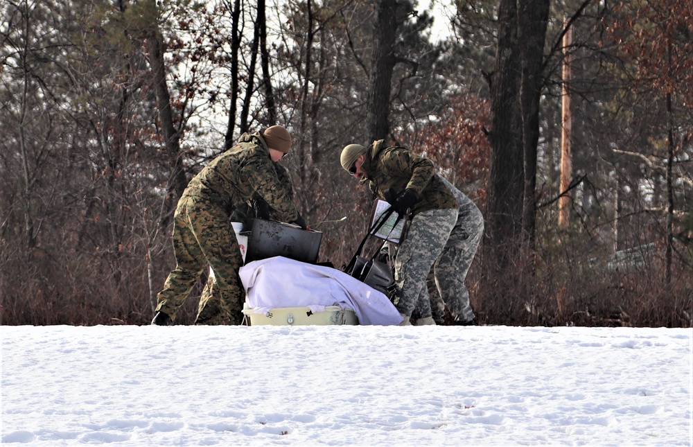 Cold-Weather Operations Course Class 20-03 students build Arctic tents during training at Fort McCoy