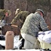 Cold-Weather Operations Course Class 20-03 students build Arctic tents during training at Fort McCoy