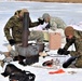 Cold-Weather Operations Course Class 20-03 students build Arctic tents during training at Fort McCoy