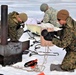 Cold-Weather Operations Course Class 20-03 students build Arctic tents during training at Fort McCoy