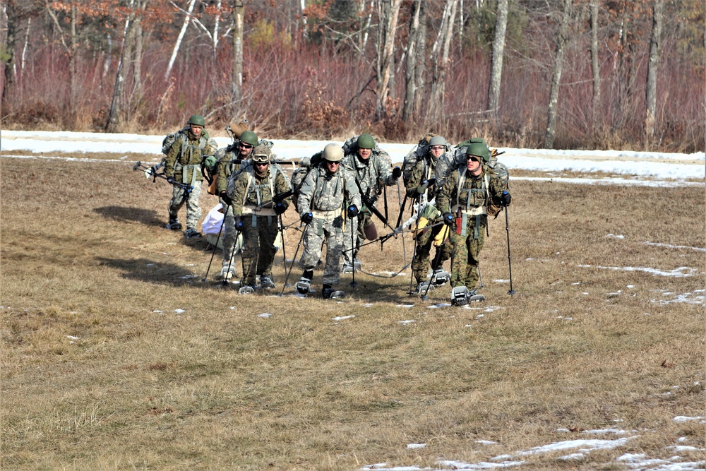 Cold-Weather Operations Course Class 20-03 students practice snowshoeing, ahkio sled use