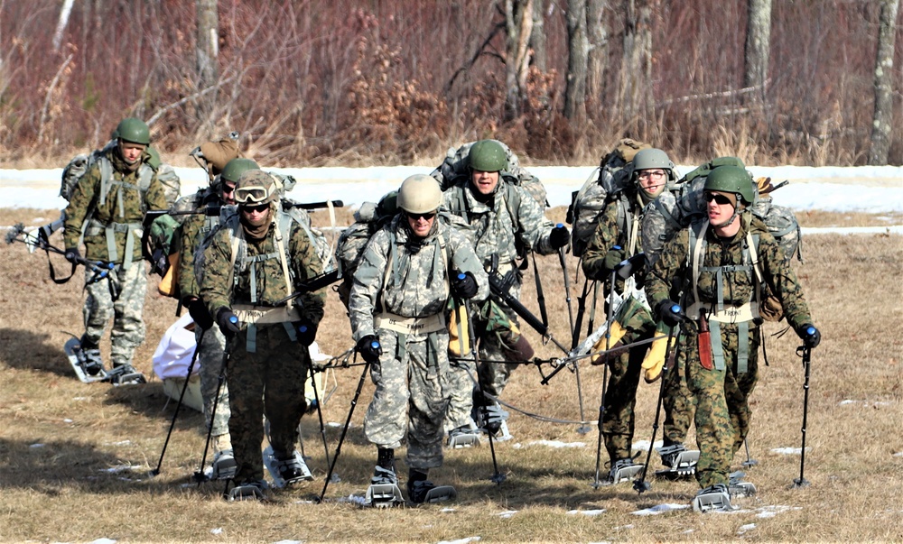 Cold-Weather Operations Course Class 20-03 students practice snowshoeing, ahkio sled use