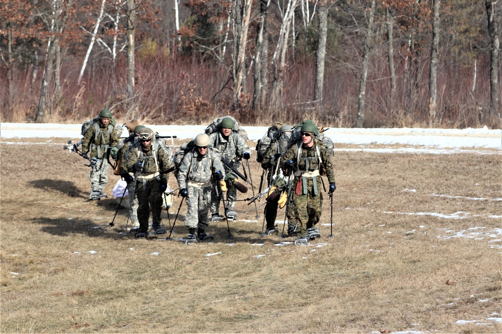 Cold-Weather Operations Course Class 20-03 students practice snowshoeing, ahkio sled use