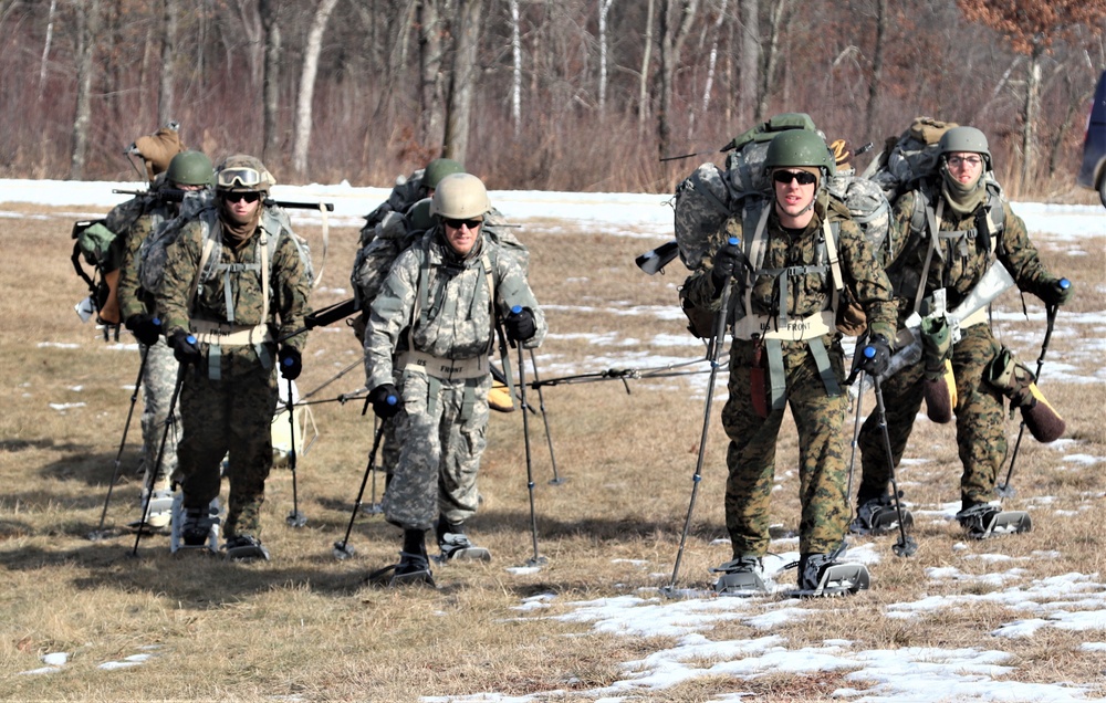 Cold-Weather Operations Course Class 20-03 students practice snowshoeing, ahkio sled use