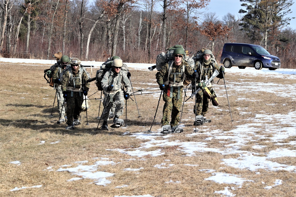 Cold-Weather Operations Course Class 20-03 students practice snowshoeing, ahkio sled use