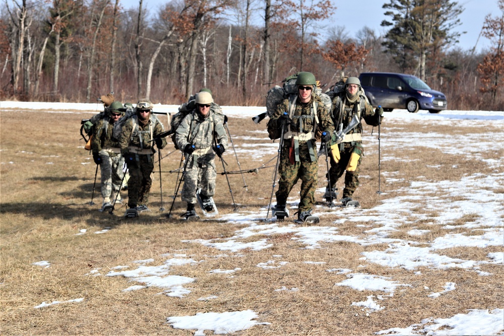 Cold-Weather Operations Course Class 20-03 students practice snowshoeing, ahkio sled use