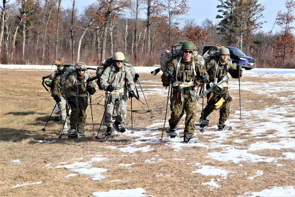 Cold-Weather Operations Course Class 20-03 students practice snowshoeing, ahkio sled use