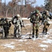 Cold-Weather Operations Course Class 20-03 students practice snowshoeing, ahkio sled use