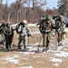 Cold-Weather Operations Course Class 20-03 students practice snowshoeing, ahkio sled use