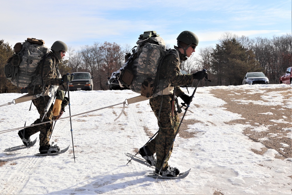 Cold-Weather Operations Course Class 20-03 students practice snowshoeing, ahkio sled use