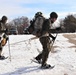 Cold-Weather Operations Course Class 20-03 students practice snowshoeing, ahkio sled use