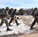 Cold-Weather Operations Course Class 20-03 students practice snowshoeing, ahkio sled use