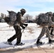 Cold-Weather Operations Course Class 20-03 students practice snowshoeing, ahkio sled use