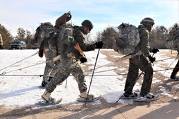 Cold-Weather Operations Course Class 20-03 students practice snowshoeing, ahkio sled use