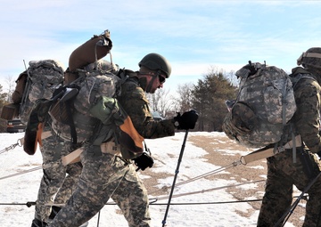 Photo Essay: Cold-Weather Operations Course Class 20-03 students practice snowshoeing, ahkio sled use