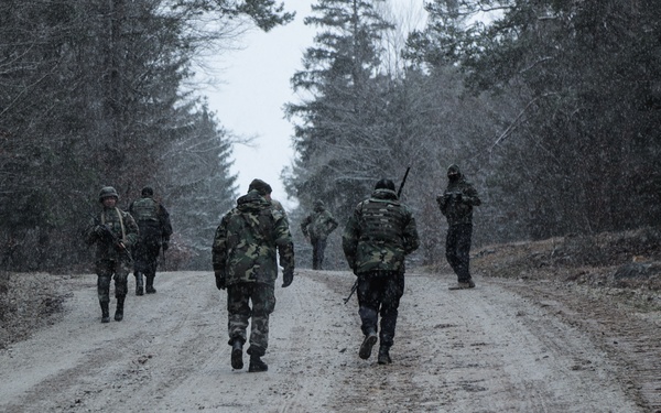 Moldovan Soldiers patrol during exercise at JMRC