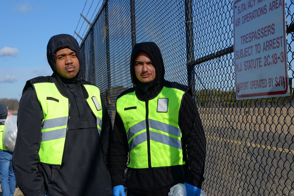 Members of the 177th Fighter Wing Student Flight Clean Up Base Perimeter
