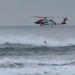 Coast Guard lowers rescue swimmer into surf