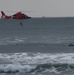 Coast Guard deploys rescue swimmer into surf