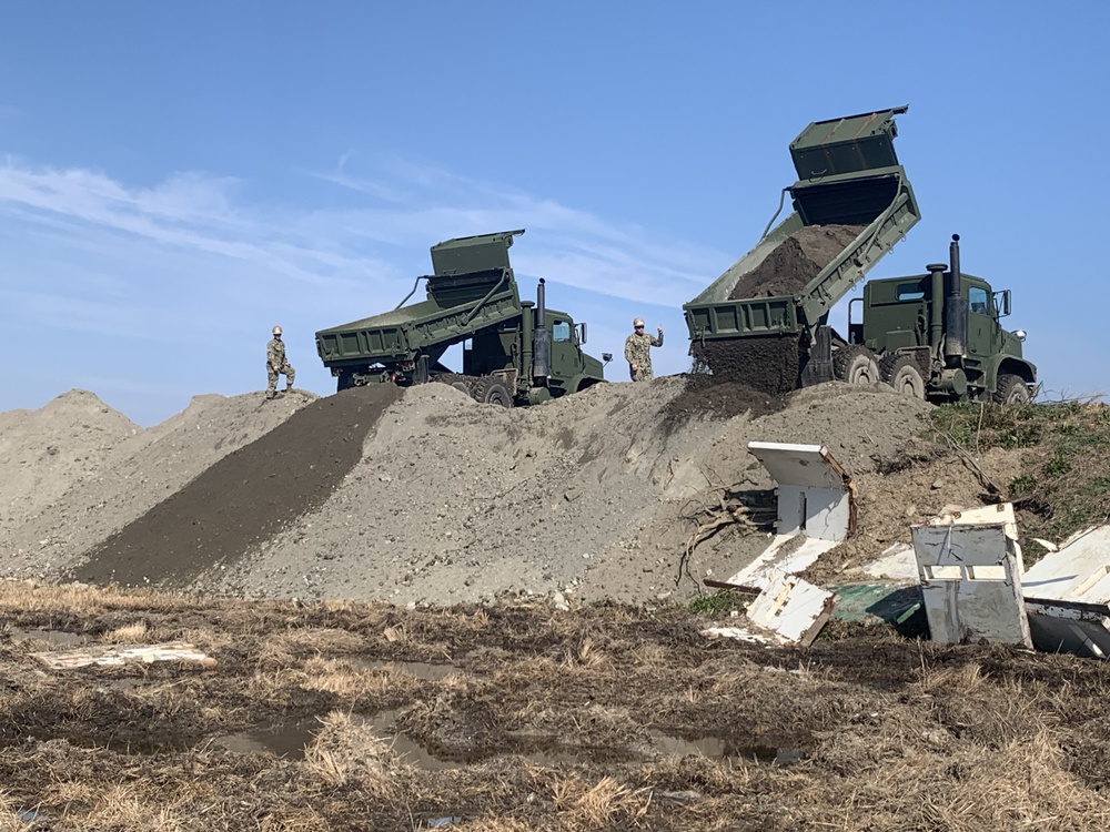 U.S. Navy Seabees deployed with NMCB-5’s Detail Iwakuni work on a landfill capping project.