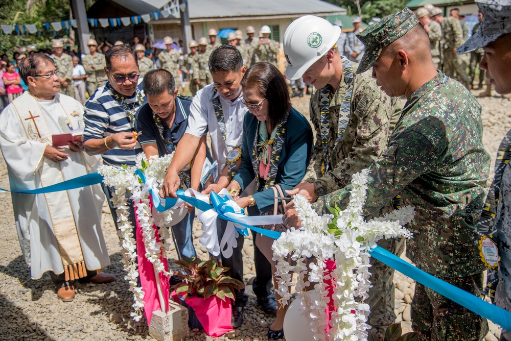 U.S. Navy Seabees with NMCB-5’s Detail Palawan attend the ribbon cutting ceremony at Malatgao Elementary School