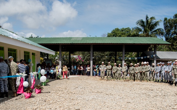 U.S. Navy Seabees with NMCB-5’s Detail Palawan attend the ribbon cutting ceremony at Malatgao Elementary School