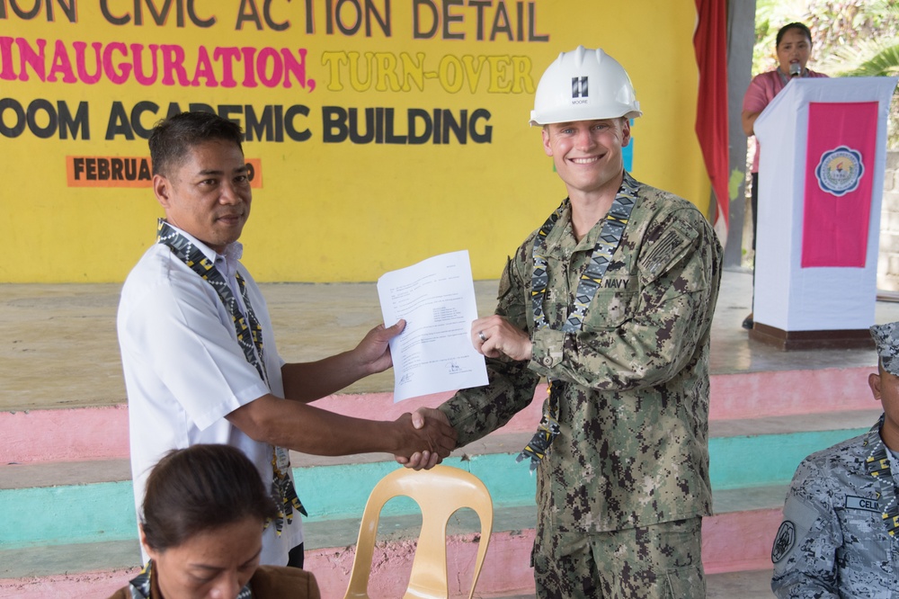 U.S. Navy Seabees with NMCB-5’s Detail Palawan attend the ribbon cutting ceremony at Malatgao Elementary School